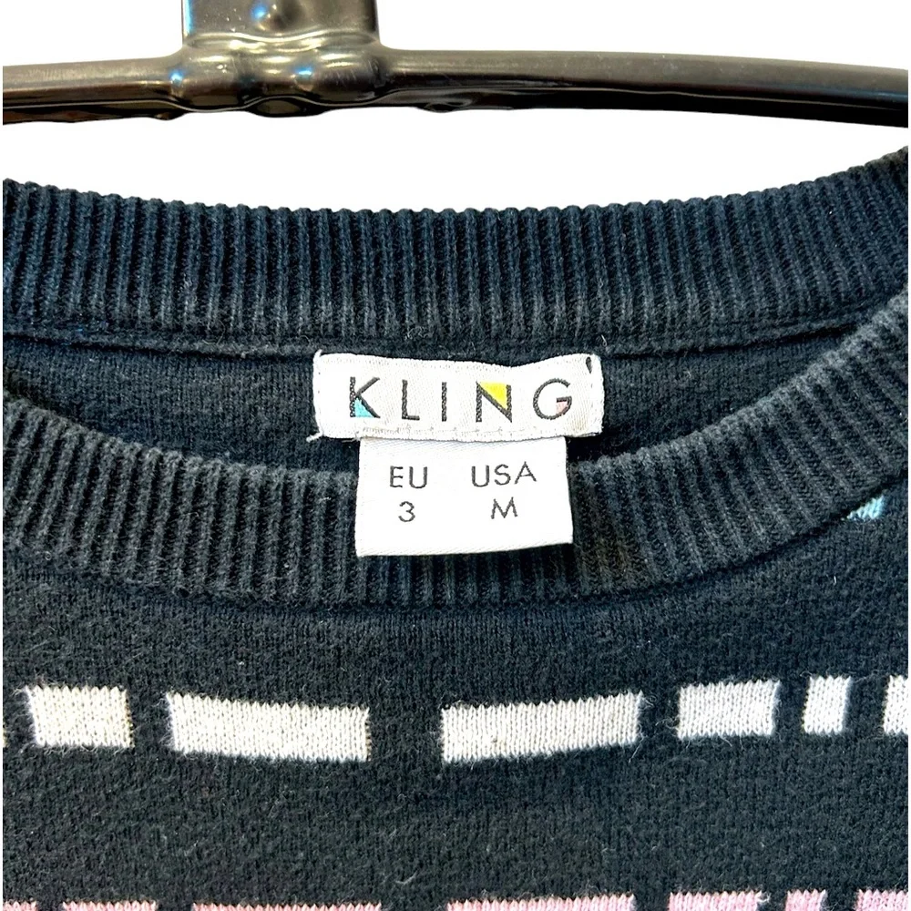 KLING Black, White, and Pastels Crew Neck Long Sleeve Sweater